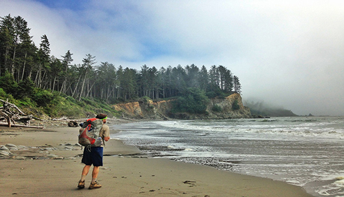 Person hiking along the beach